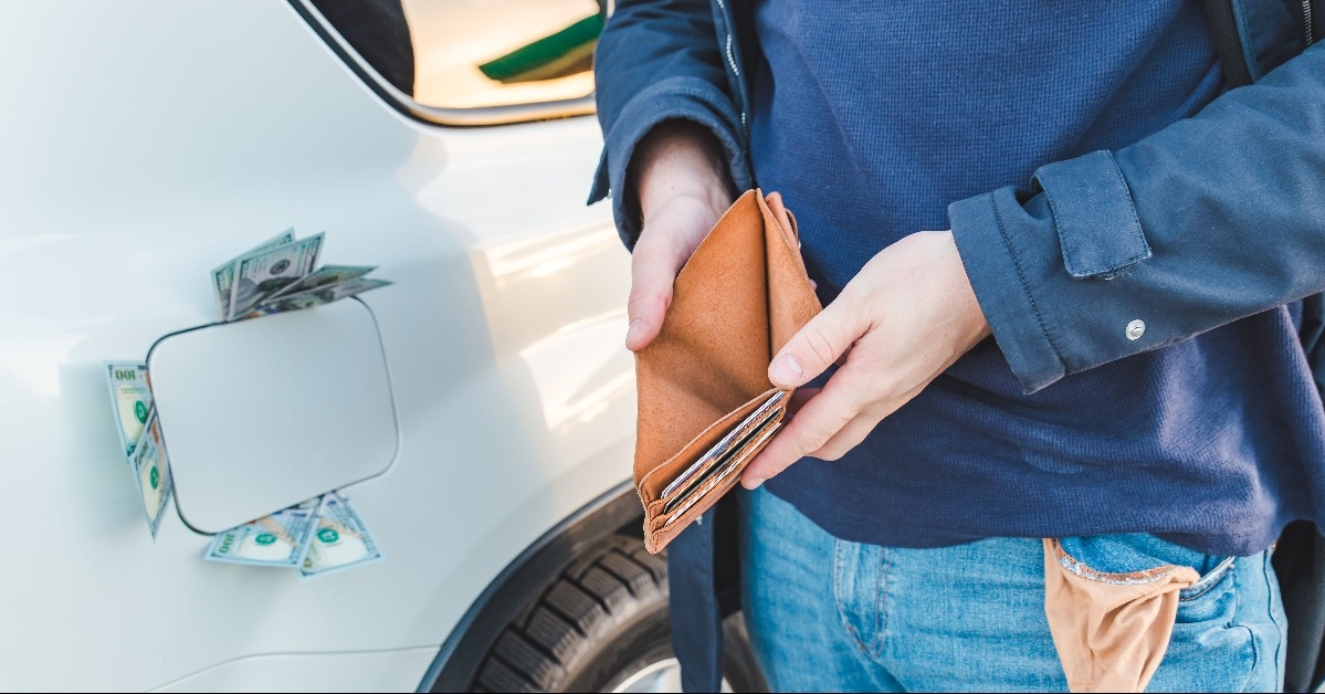 man standing with empty wallet