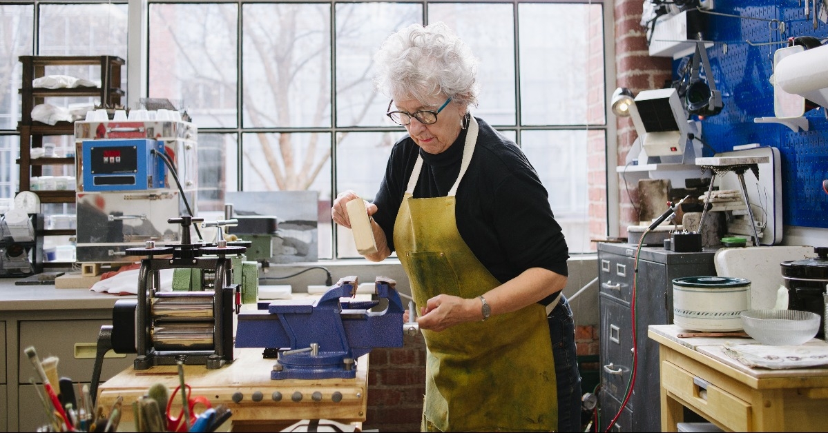 Art Jeweler Working in Studio