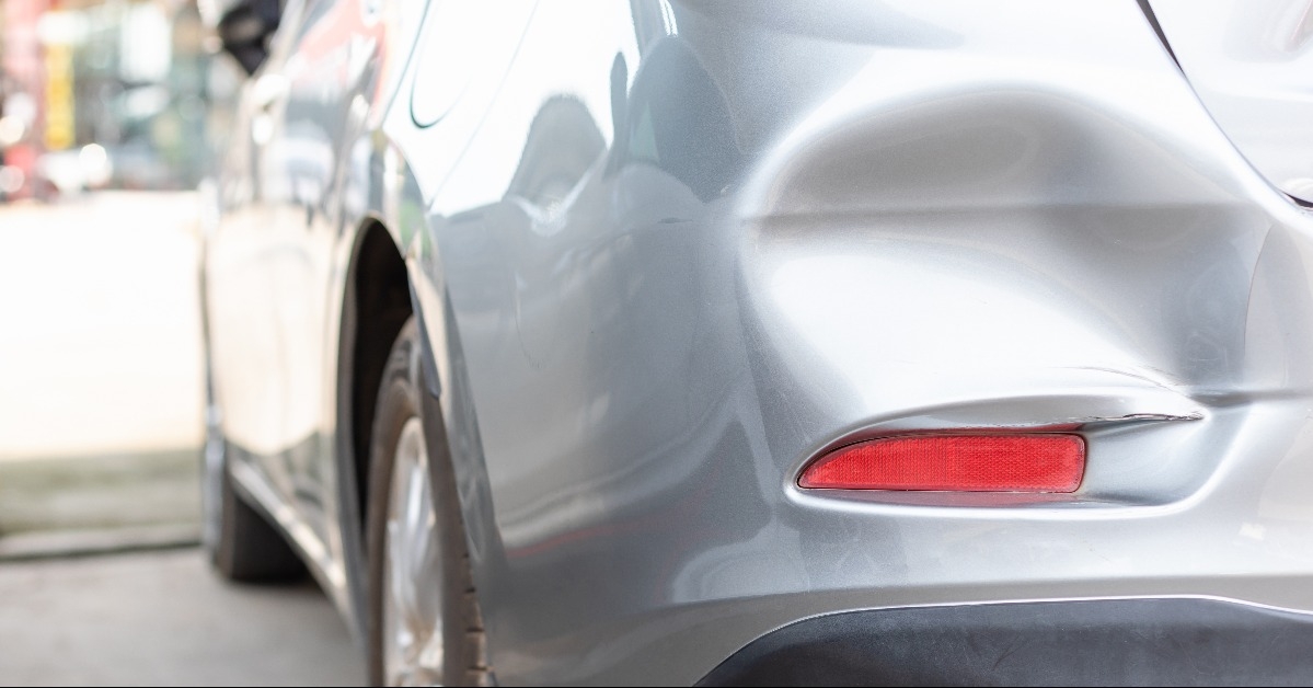 Backside of new silver car get damaged by accident