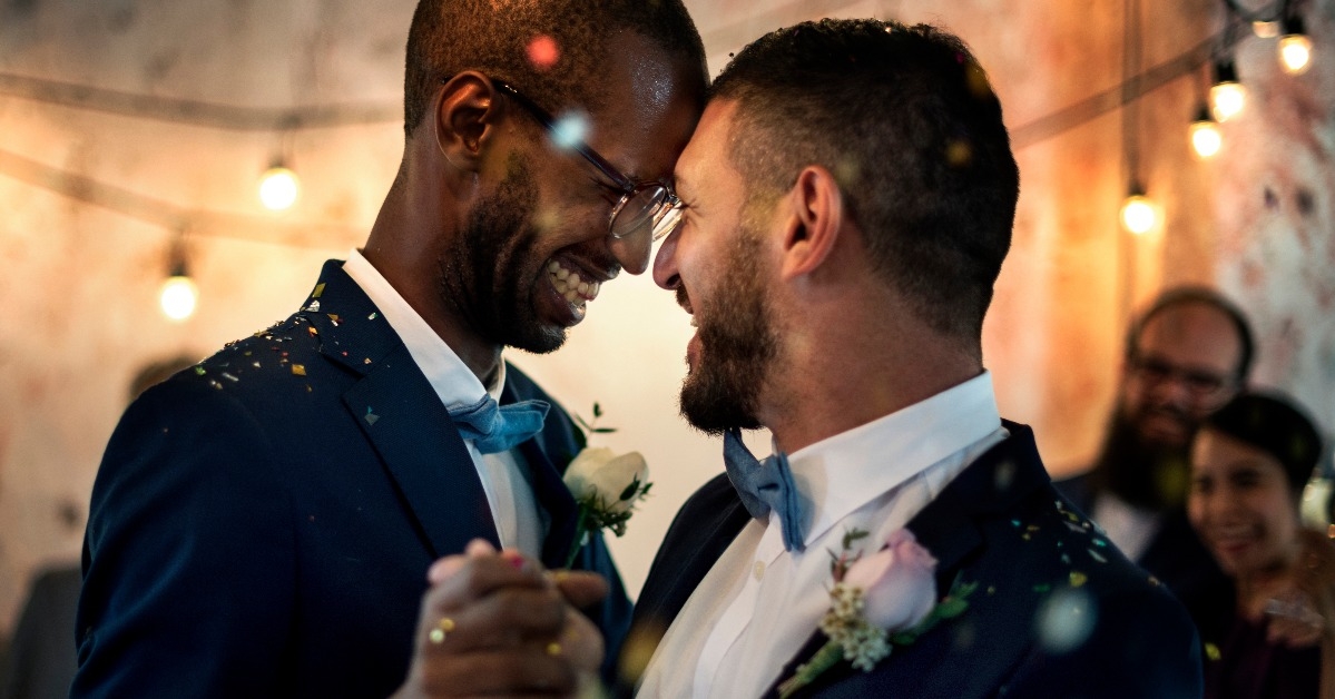 Smiling couple dancing on their wedding day