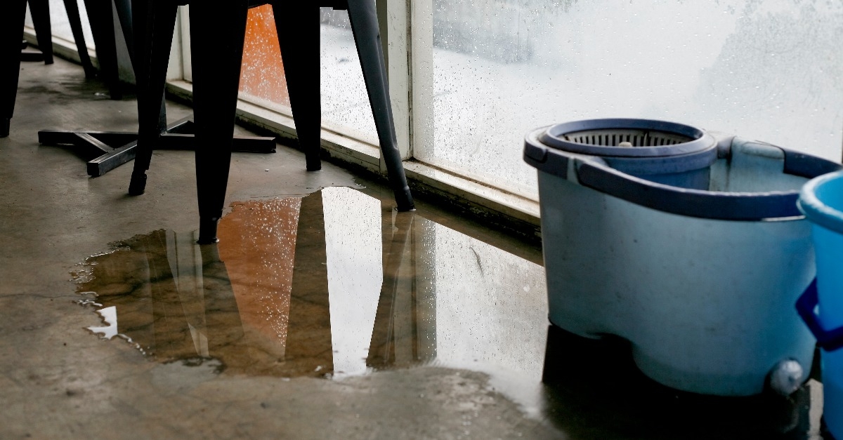 water puddle on floor due to leakage in the rainy day