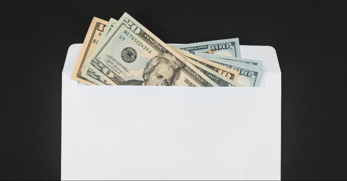 White paper envelope with money