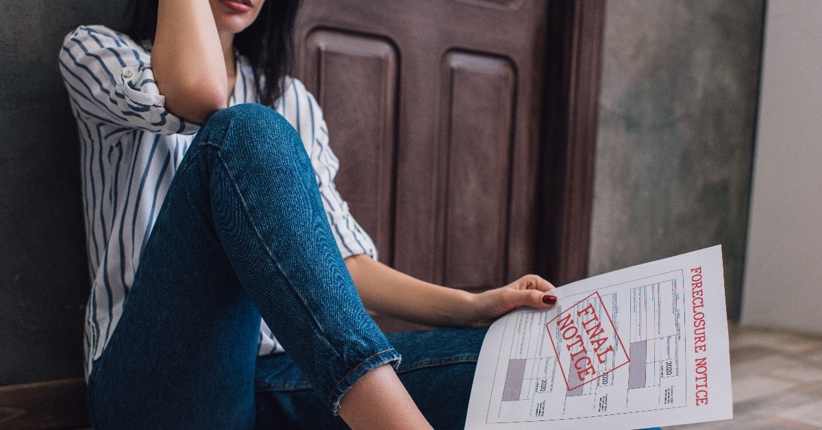 woman holding document with foreclosure
