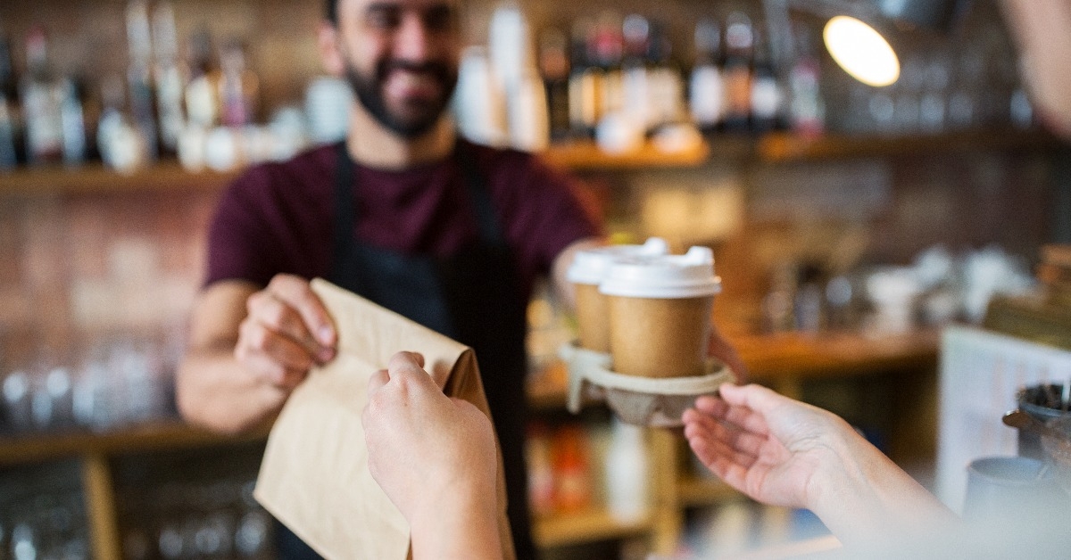 serving customer at coffee shop