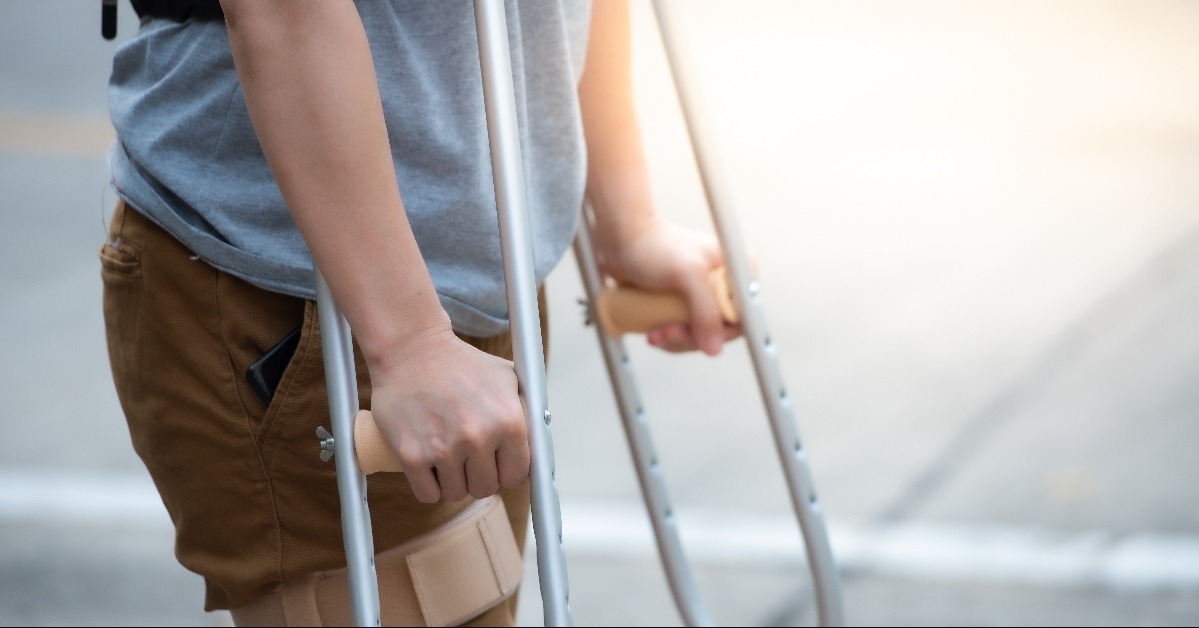 disabled woman with crutches