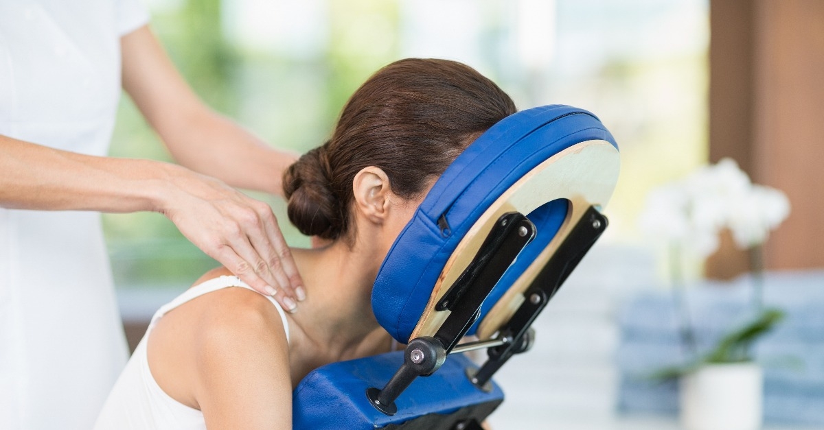 young woman receiving back massage