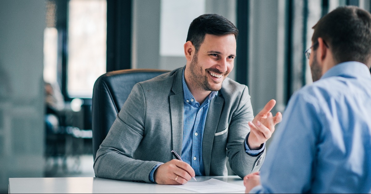 man having a business meeting and signing a contract