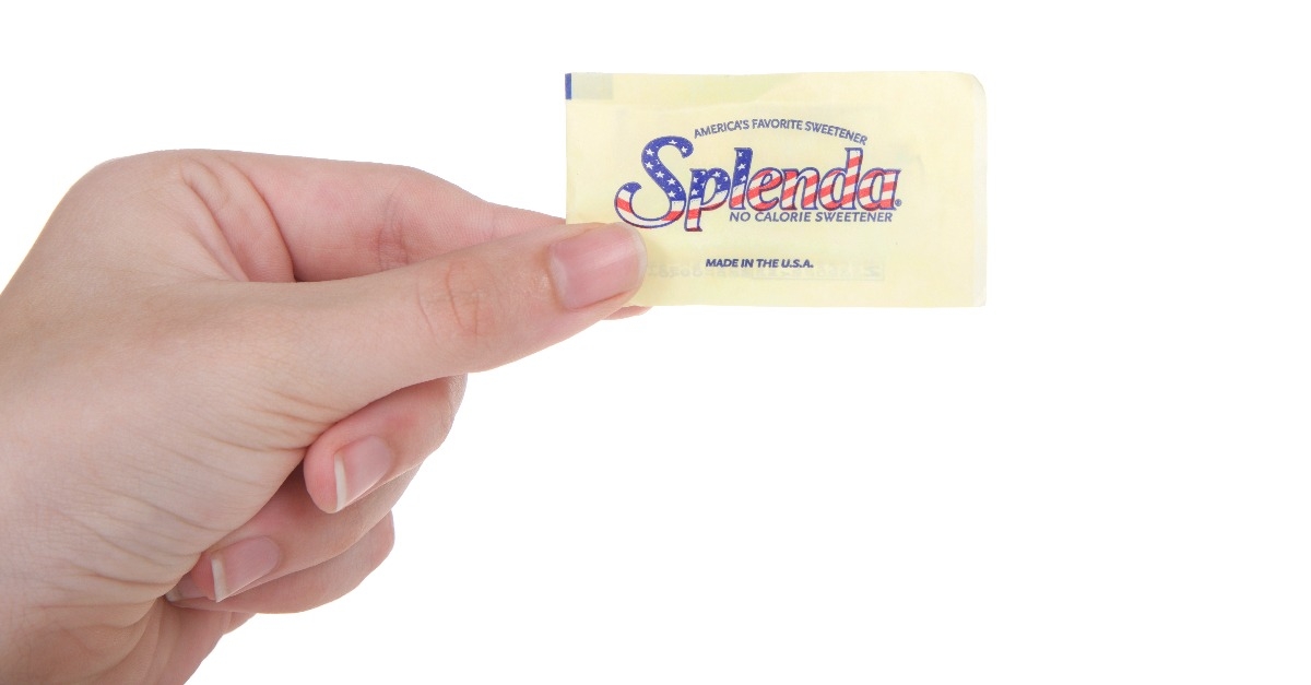  hand holding one packet of Splenda artificial sweetener