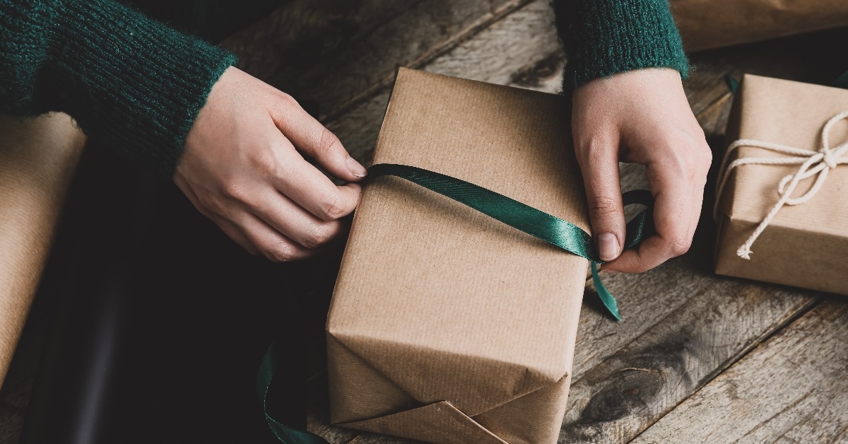 woman making beautiful Christmas gift at table