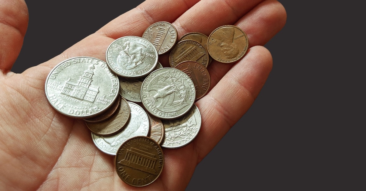 pile of coins sitting in a hand