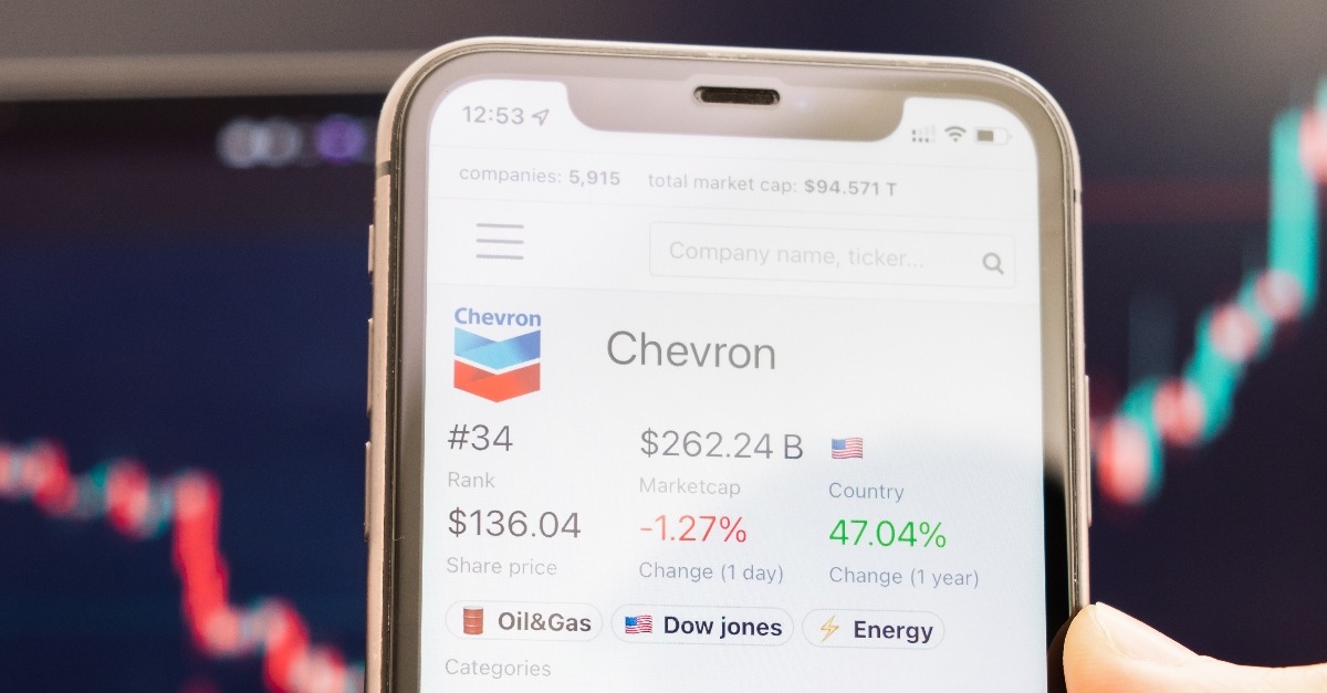 Chevron stock price on the screen of mobile phone