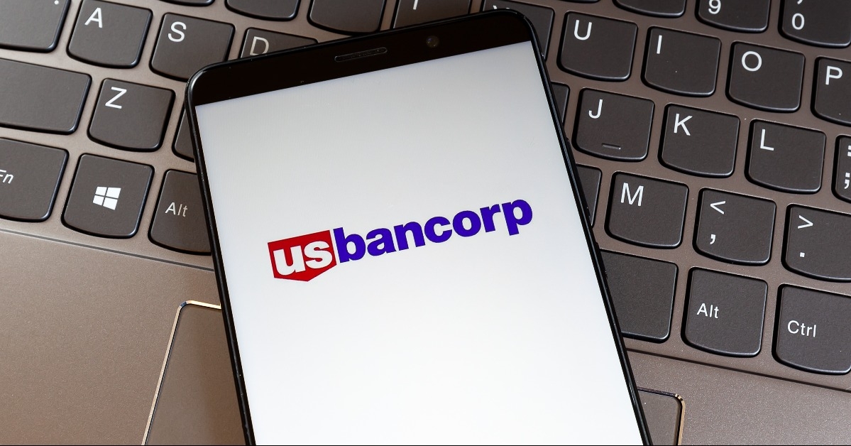 US Bancorp logo on smartphone screen on keyboard