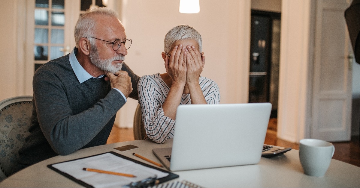 worried senior couple