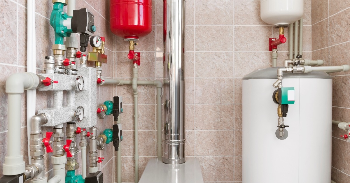 house boiler room interior with modern water heating system