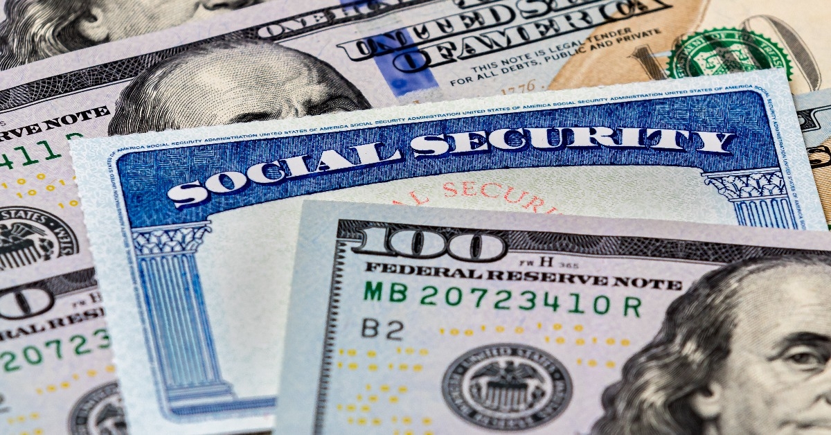 social security benefits identification card with 100 dollar bills