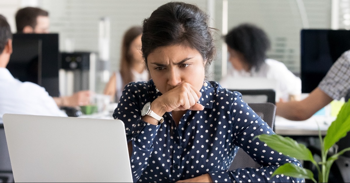 Indian businesswoman looking at laptop screen