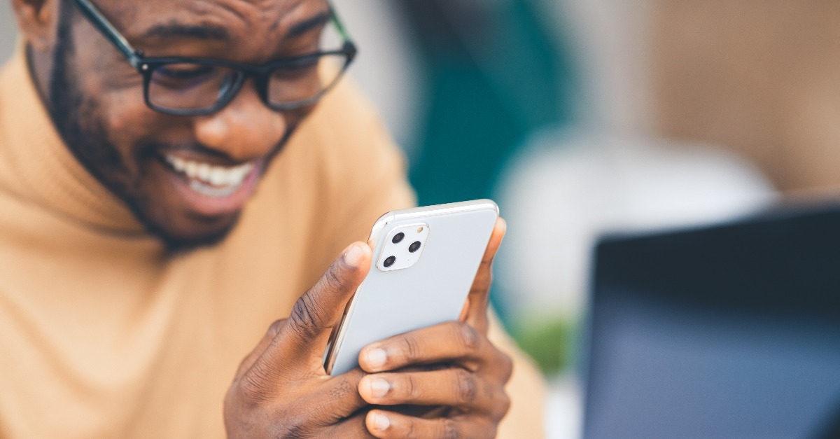 man holding Apple iPhone 11 Pro Max
