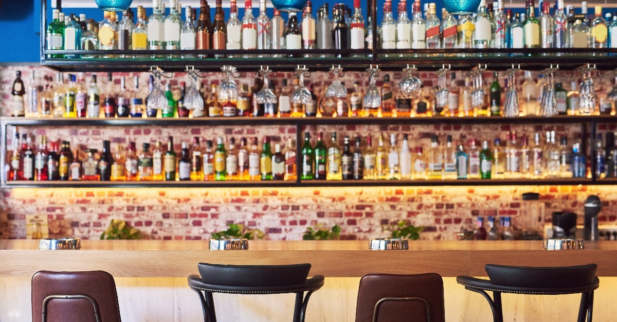 bar with many bottles and glasses wines