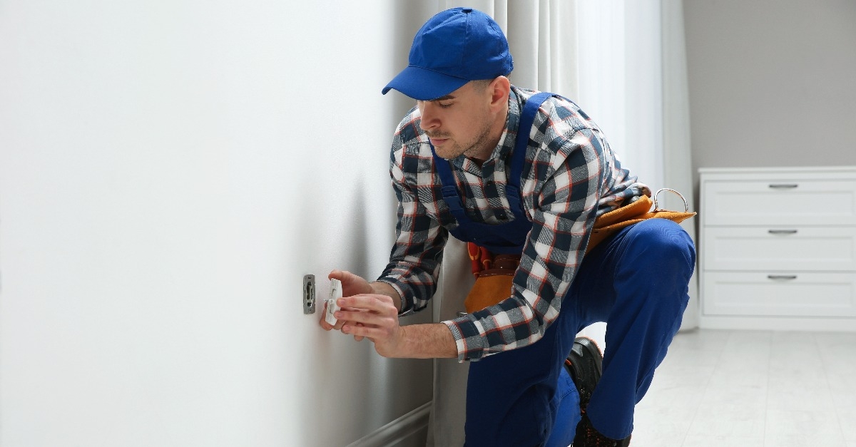 electrician repairing power socket