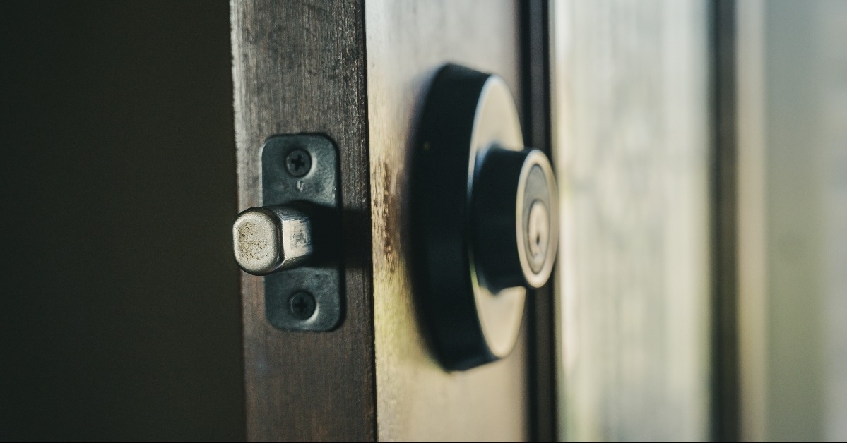 deadbolt on wooden door engaged with bolt