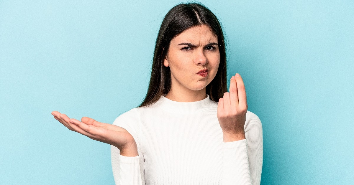 woman isolated on blue background showing that she has no money