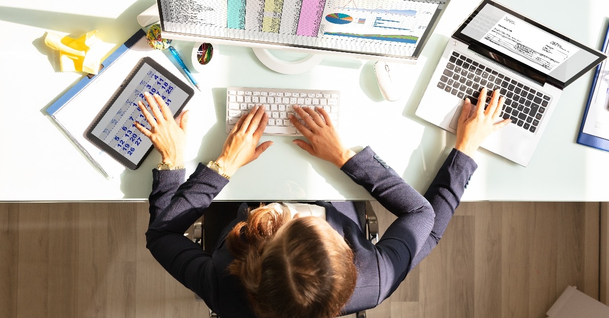 businesswoman doing multitasking work in office 