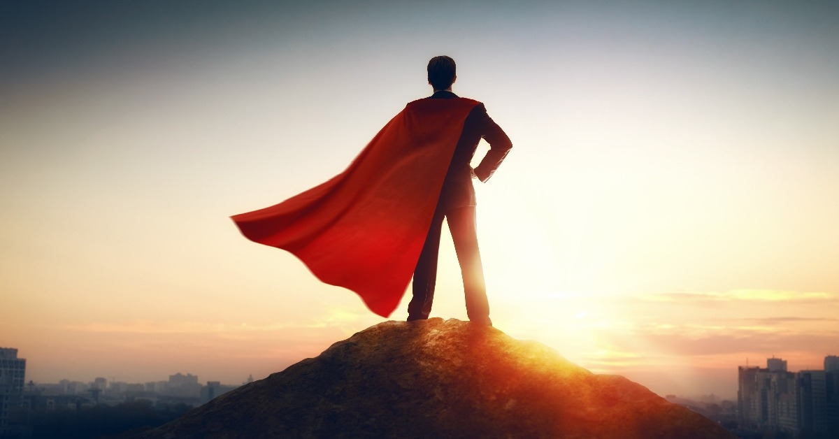 superhero businessman looking at city