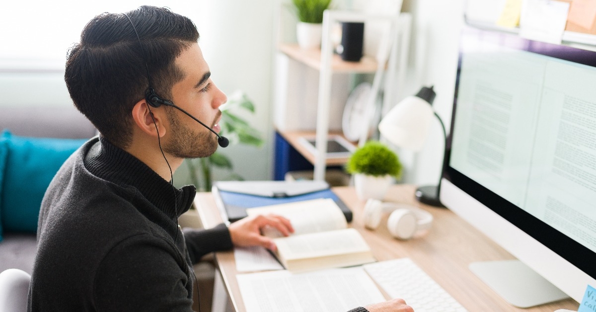 translator working at his home office desk