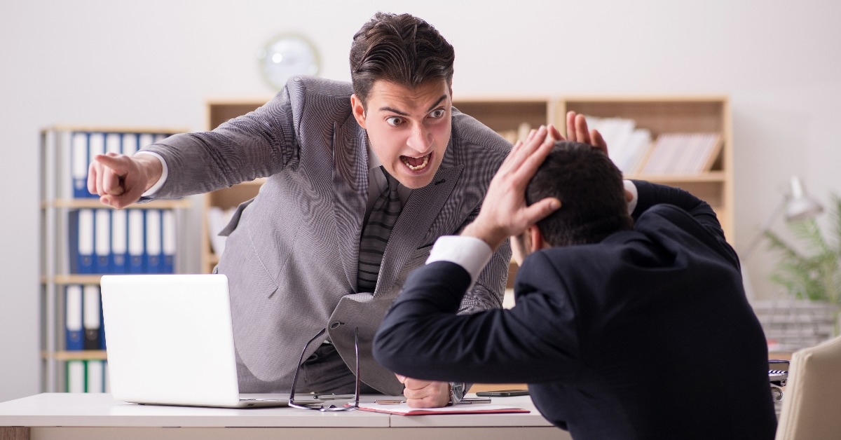 angry boss shouting at his employee