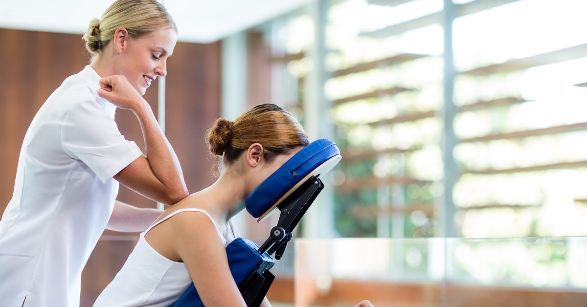 Massage therapist and client