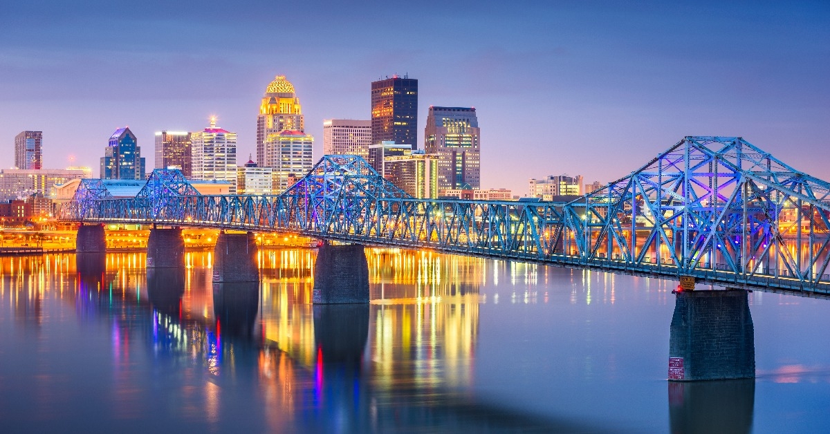 Louisville Kentucky USA downtown skyline on the Ohio River at dusk