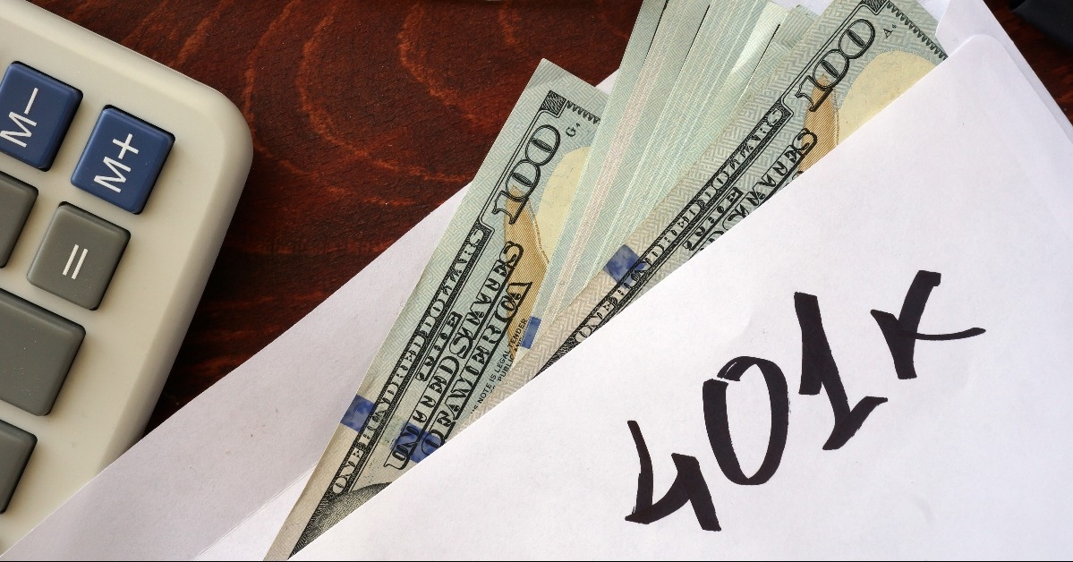 401k written on an envelope with dollars