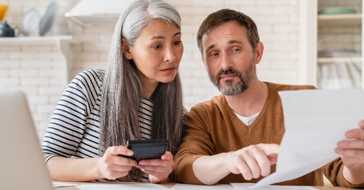 middle-aged couple doing financial paperwork