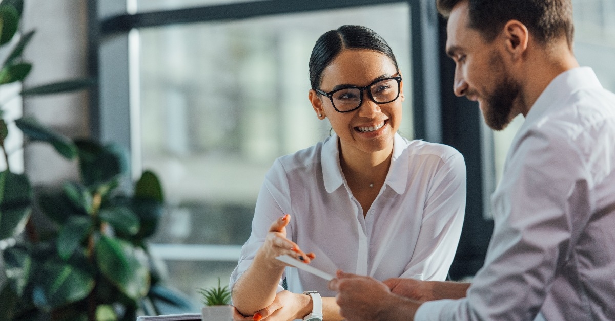 translator working with smiling businesswoman