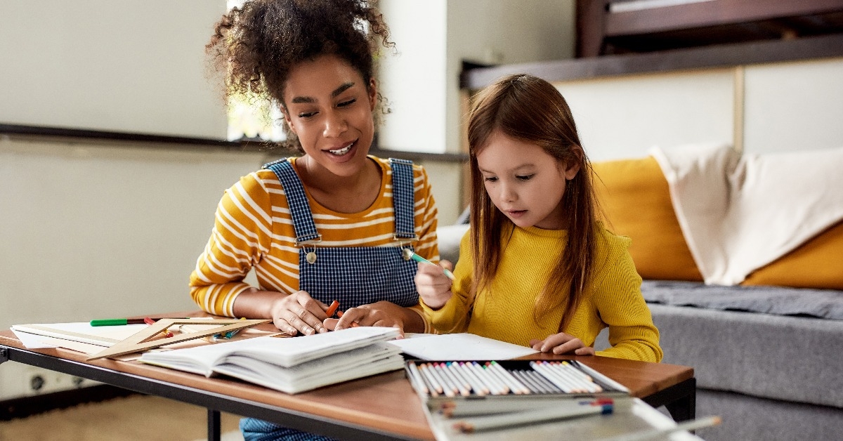 little girl spending time with her baby sitter