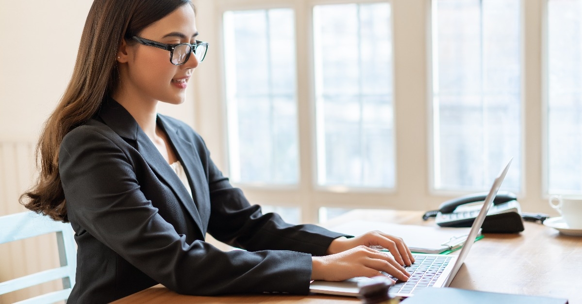 consultant working with laptop in office