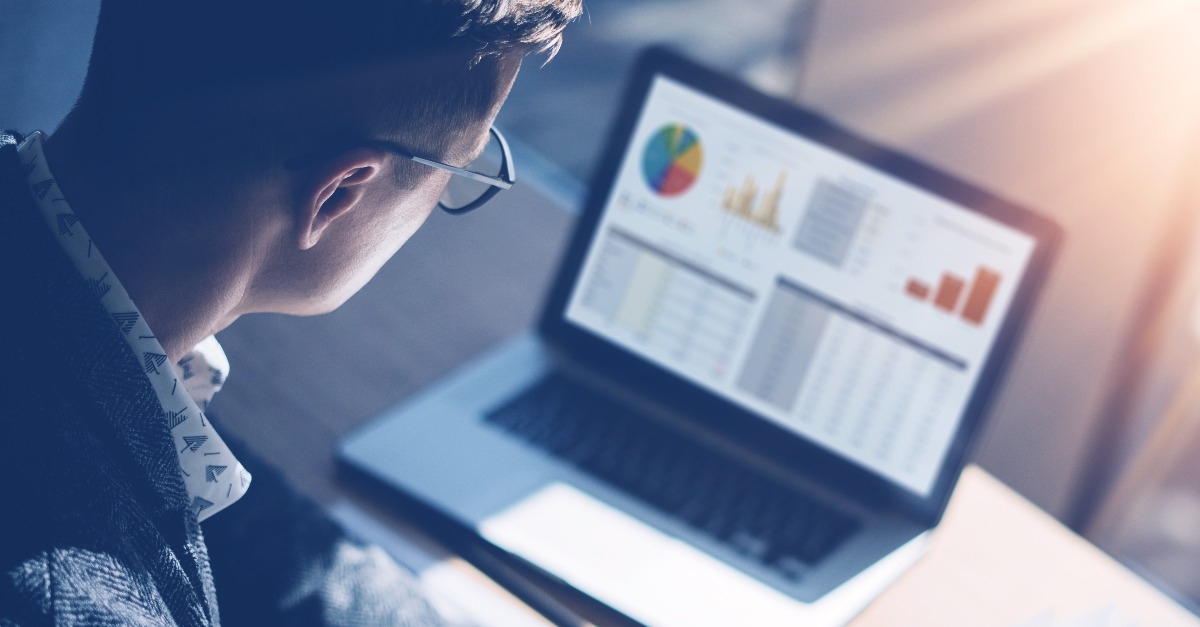 finance market analyst in eyeglasses working