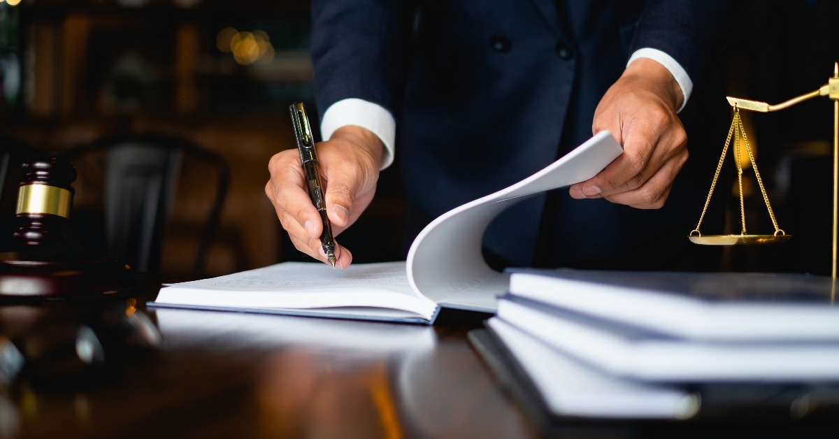 lawyer reading lawbook in office