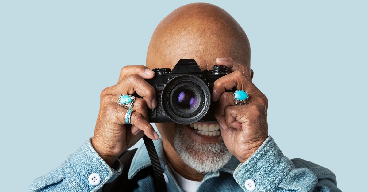 senior man with a digital camera
