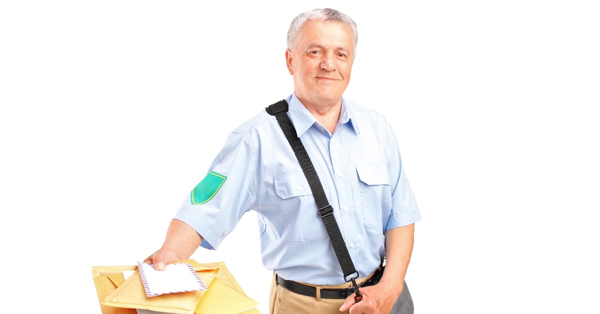 smiling postman delivering letters