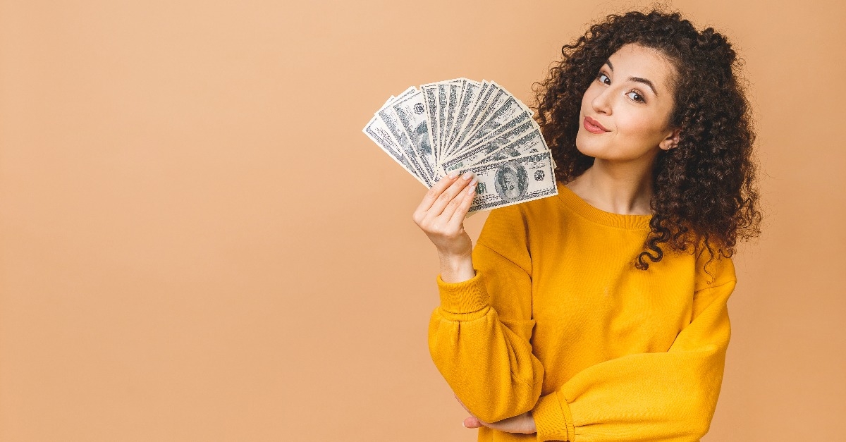 young woman holding money banknotes 
