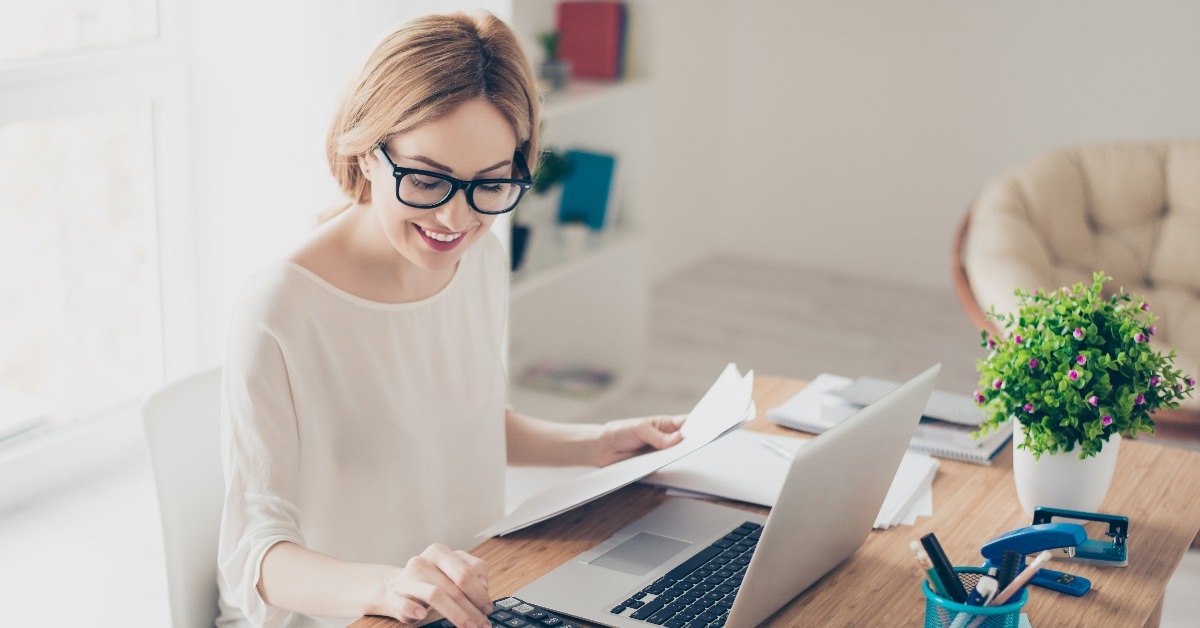 accountant working with computer and calculator
