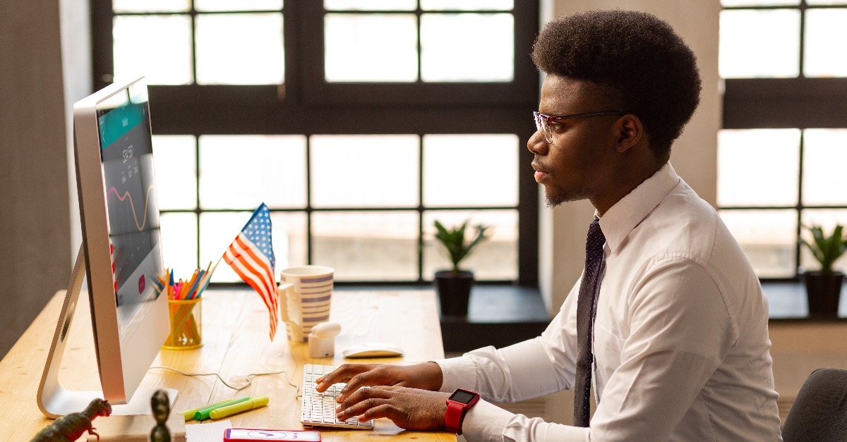 serious young man analyzing financial statistics
