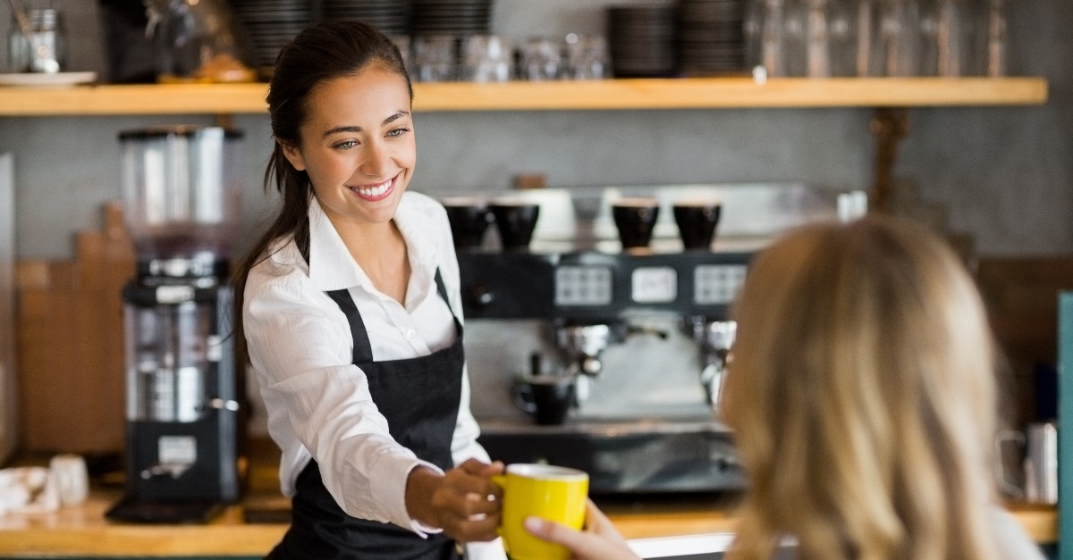 waitress offering a cup of coffee
