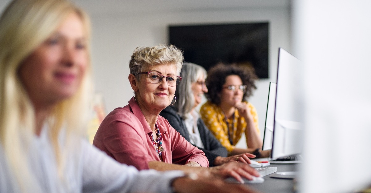 senior people attending computer and technology education class