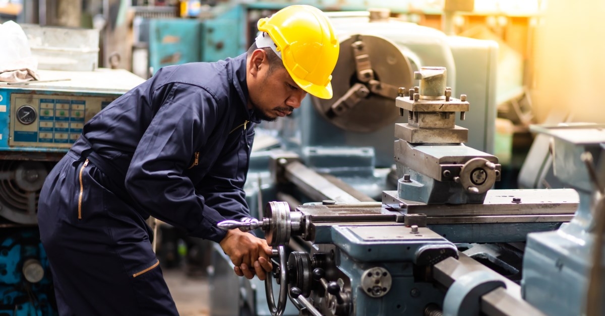 a hard working asian man in a factory