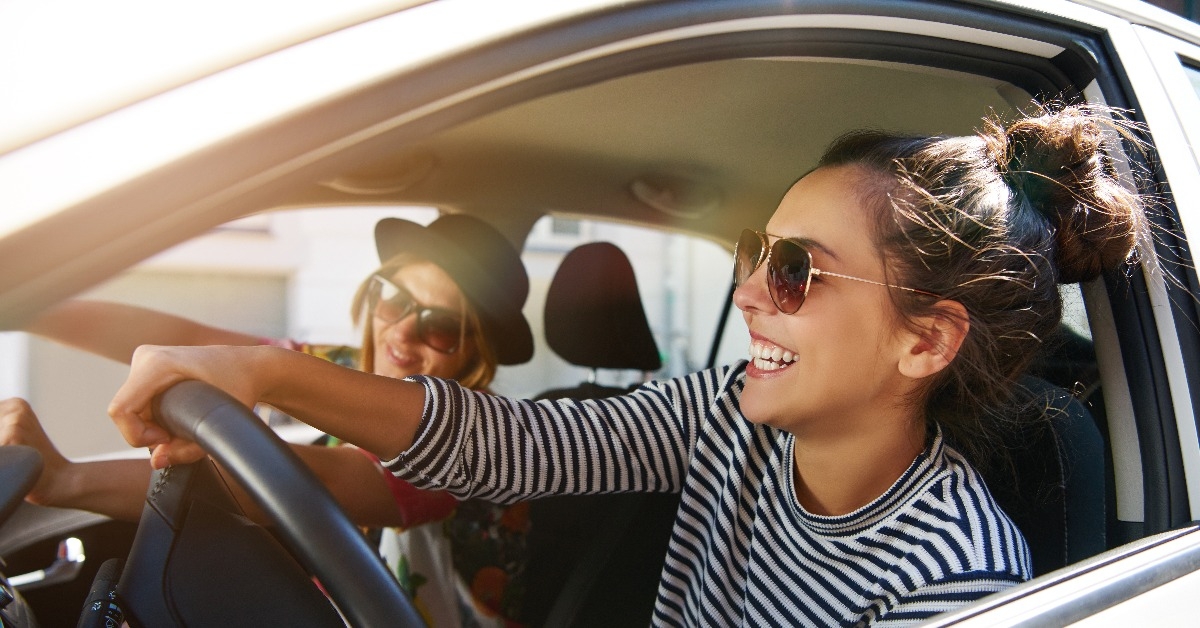  young women driving in a car