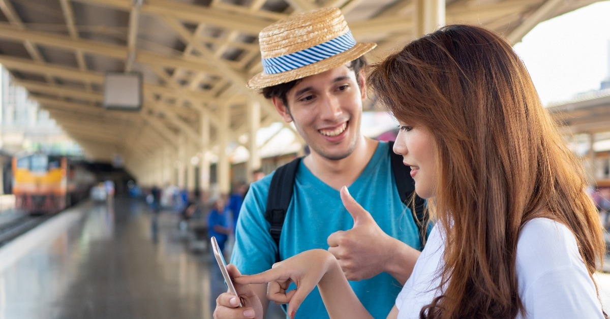 asian woman speaking fluent foreign language with foreigner