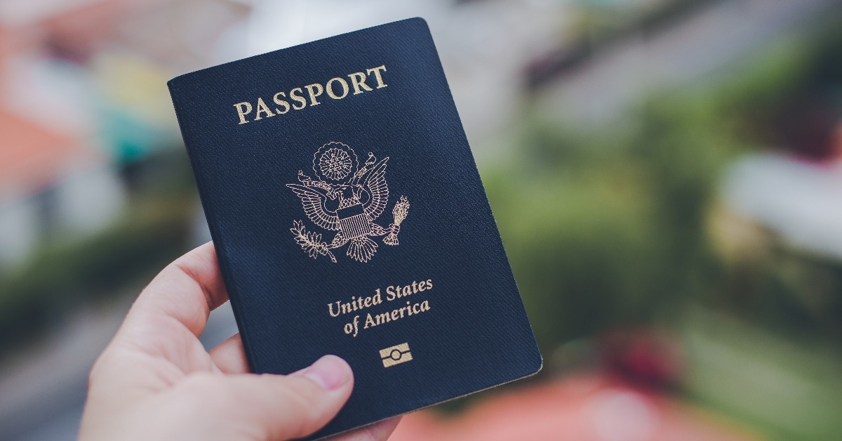 hand holding a blue American passport