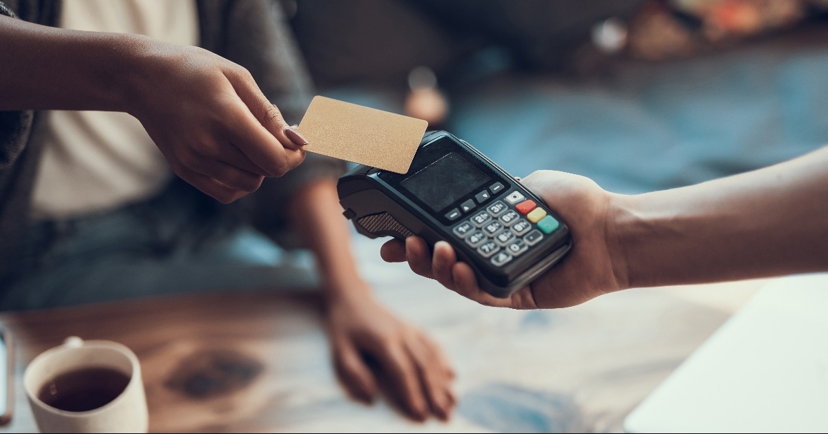 woman paying with credit card